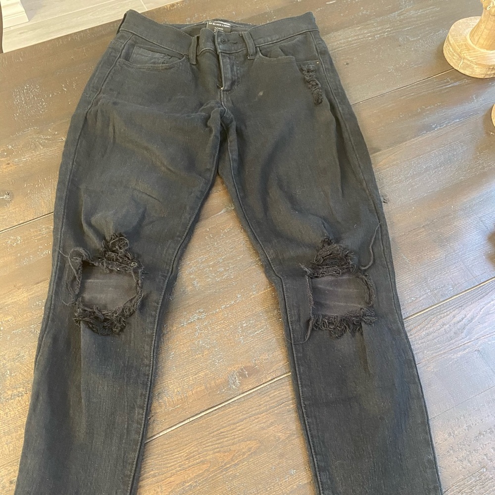 Mid rise black ripped jeans